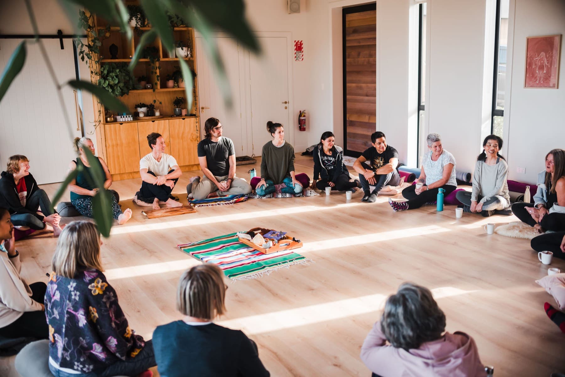 Women gathered together in the retreat space at Kula Muriwai