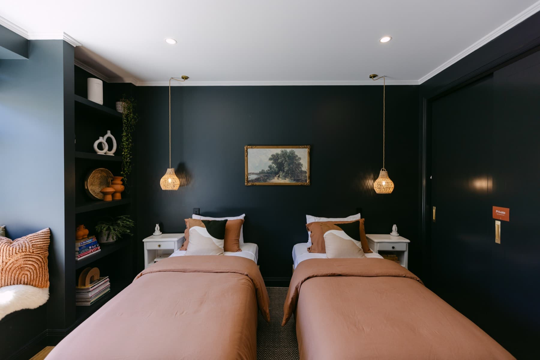 The Kirikiri Bay Room at Kula Muriwai, a twin share room with two king single beds