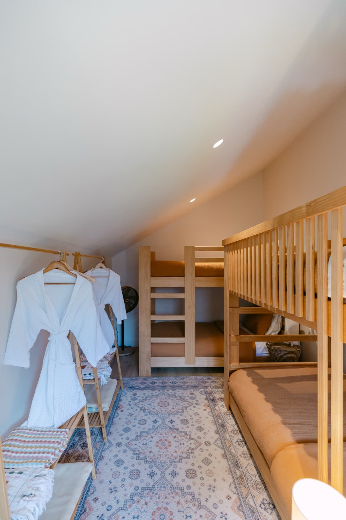The Pillow Lava Bay Room at Kula Muriwai, king single bunk beds in a light shared room